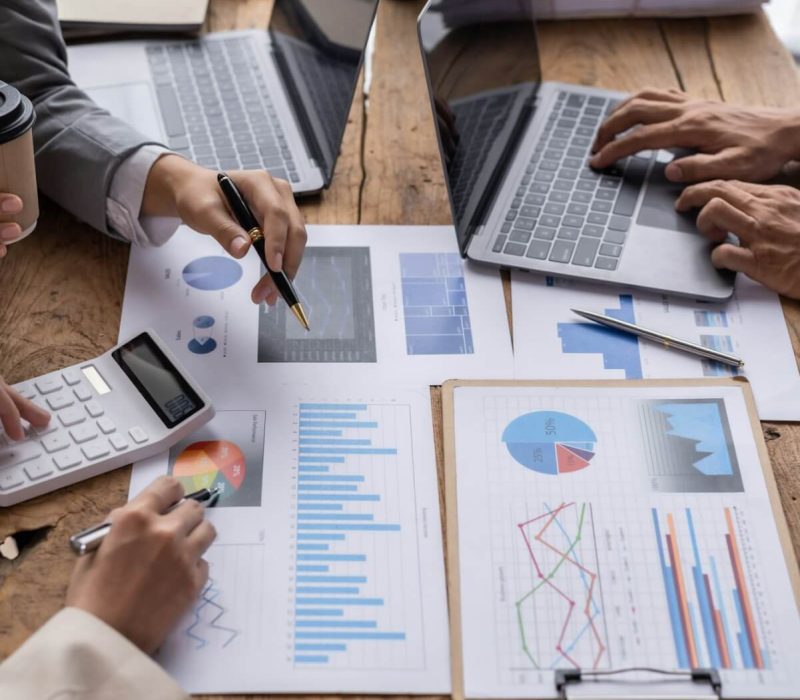 financial-analysts-analyze-business-financial-reports-on-digital-tablet-planning-investment-project.jpg